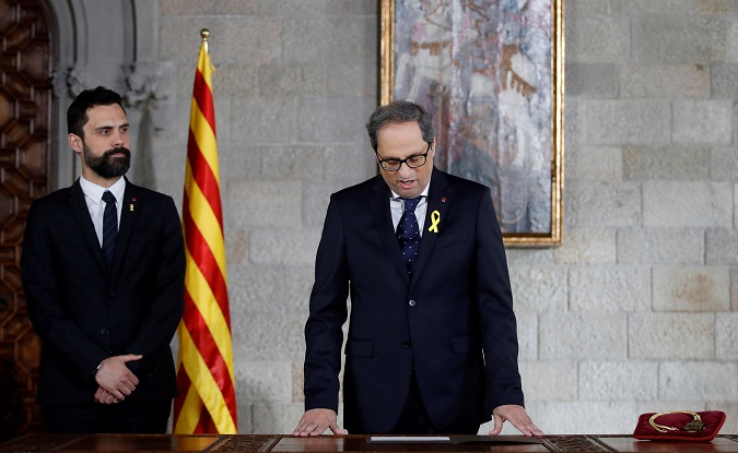 Quim Torra takes his oath as new Catalan Regional President during a ceremony at Generalitat Palace in Barcelona, Spain, May 17, 2018.