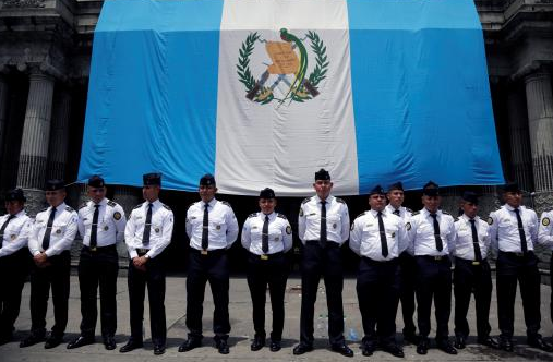 Police stand guard outside Guatemala's Congress during an anti-government protest in Guatemala City, September 2017.
