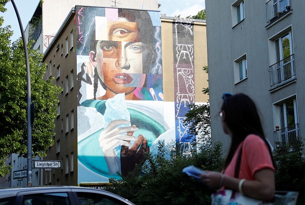 Between May 14 and 18, world-renowned artists such as El Bocho, Mr Woodland, The Weird and the Kiebebande designed facades for more than 10,000 square meters of wall space across Berlin. Here, a work by urban artist Elle is pictured as part of the first Berlin Mural Fest. 