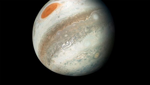 NASA's Juno spacecraft captured this color-enhanced image of Jupiter, around which the 'alien asteroid' orbits.