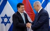 Paraguayan President Horacio Cartes shakes hands with Israeli Prime Minister Benjamin Netanyahu during a meeting at the Prime Minister