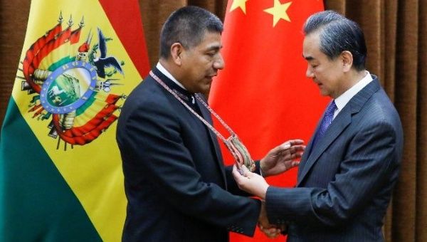 Bolivian Minister of Foreign Affairs Fernando Huanacuni Mamani (L) meets with Chinese counterpart Wang Yi.