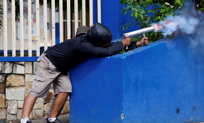 A protester fires a mortar during protests in Managua, Nicaragua.