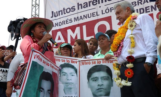 Lopez Obrador with relatives of the missing 43 students from the teachers' college of Ayotzinapa, in Iguala, Guerrero. May 25, 2018.