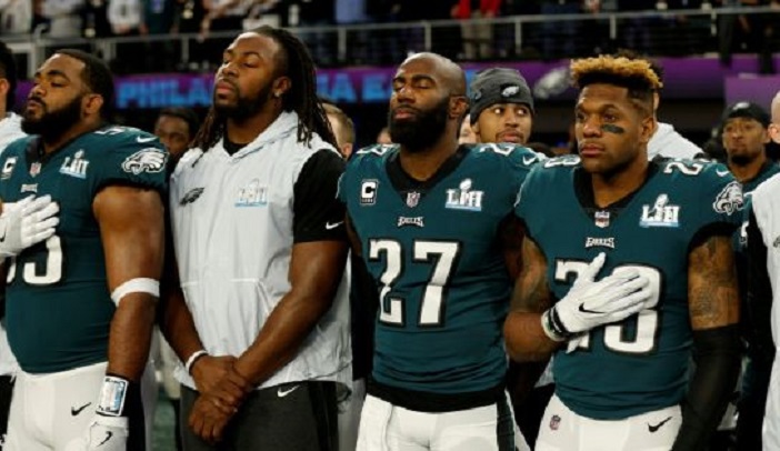 Malcolm Jenkins (centre) of the Philadelphia Eagles during the US national anthem before the Super Bowl in Minnesota.