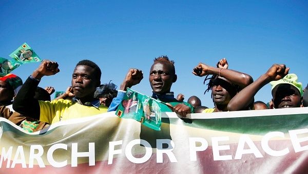 Supporters of President Emmerson Mnangagwa's ZANU PF party march for non-violent, free and fair general elections in Harare.