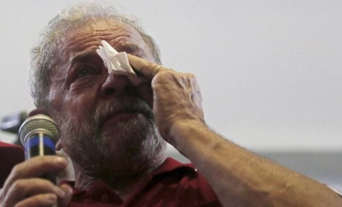 Former Brazilian President Luiz Inacio Lula da Silva sheds a tear as he speaks to supporters.