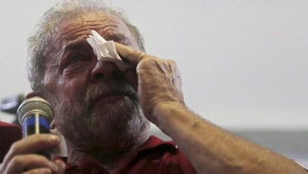 Former Brazilian President Luiz Inacio Lula da Silva sheds a tear as he speaks to supporters.