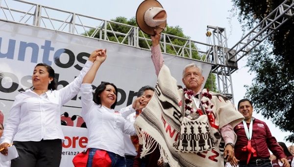 Leftist front-runner Andres Manuel Lopez Obrador waves to supporters during a campaign rally in in Michoacan state, Mexico.