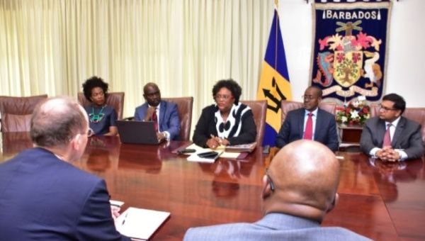 Barbados' Prime Minister Mia Mottley (center back) meets with IMF reps.