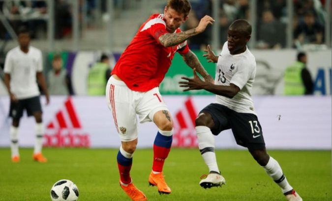 Russia’s Fedor Smolov and France’s N'Golo Kante compete in a friendly match before the World Cup.
