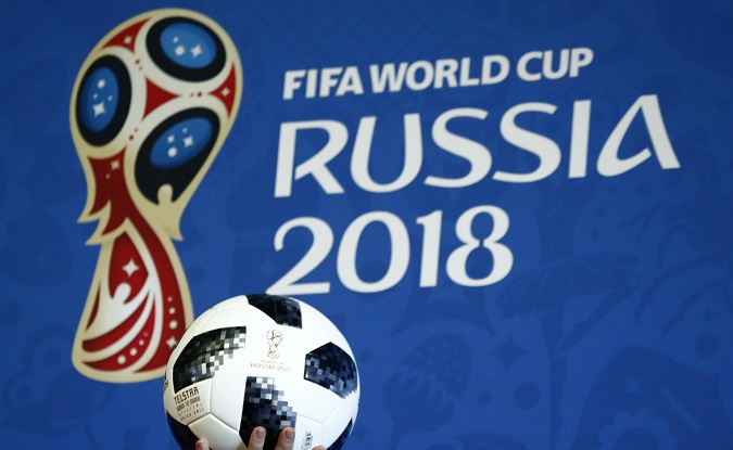 A presenter holds the official match ball for the 2018 FIFA World Cup Russia