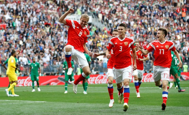Russia's Yury Gazinsky celebrates after scoring his team's first goal at the 2018 World Cup.