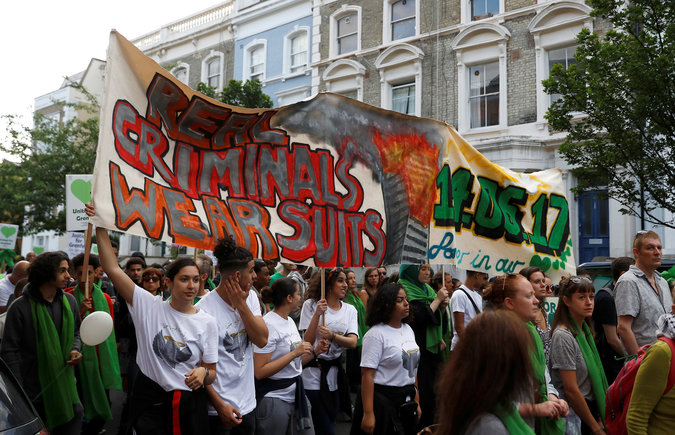 Participants in a Silent March mark the first anniversary of the Grenfell Tower fire in London, Britain, June 14, 2018. Police estimated 5,000 people joined the march. 