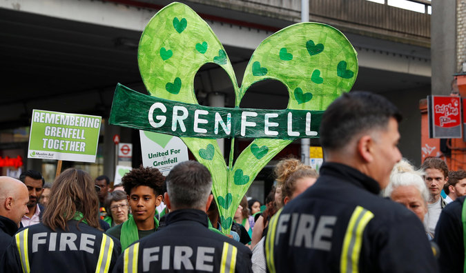 Friends and relatives of the 71 people killed in the blaze led the march, with thousands more following them wearing green scarves and holding green banners – a colour adopted by the community of survivors and the bereaved as a symbol of tragedy.