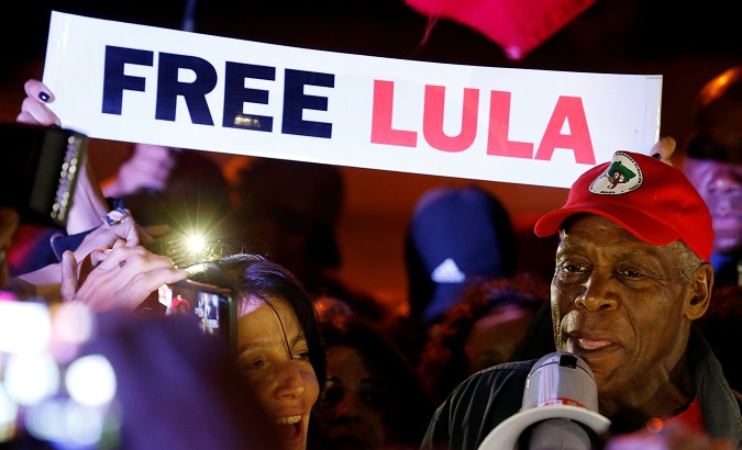 U.S. actor Danny Glover chants slogans in support of former Brazilian President Luiz Inacio Lula da Silva at a camp near the Federal Police headquarters, where Lula is imprisoned, in Curitiba, Brazil May 30, 2018.