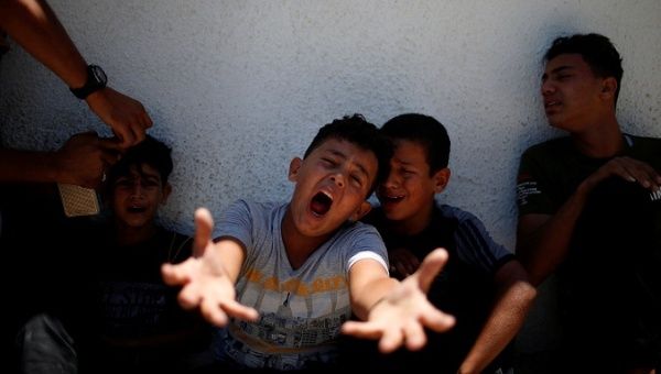 The brother of a Palestinian, who was killed at the Israel-Gaza border, reacts at a hospital in Gaza City June 18, 2018.