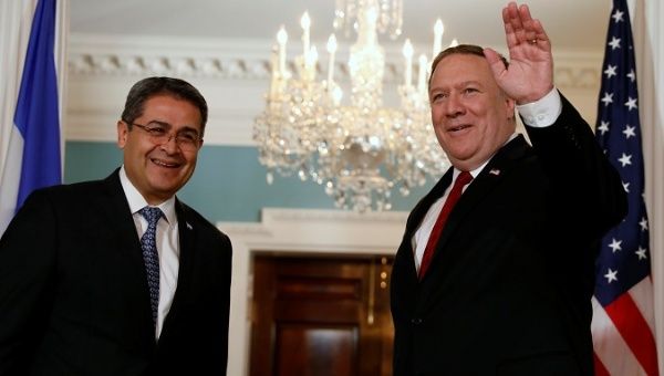 U.S. Secretary of State Mike Pompeo waves before his meeting with Honduran President Juan Orlando Hernandez at the State Department in Washington, U.S., June 18, 2018. 