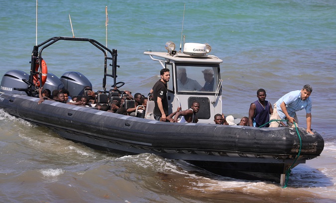 Migrants in a boat on the coast of Tajoura, east of Tripoli, in Libya on June 20, 2018.