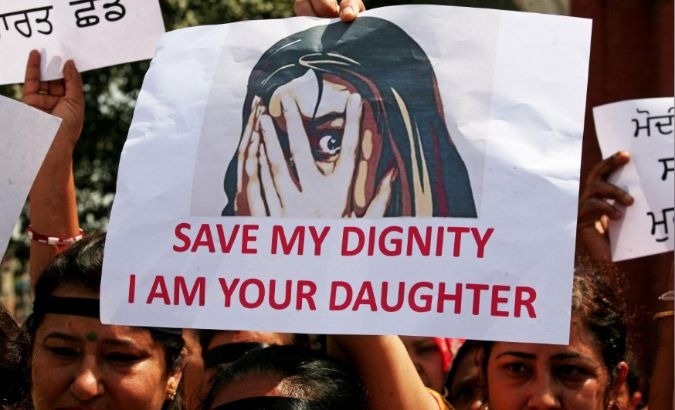 People participate in a protest against the rape of an eight-year-old girl in India.