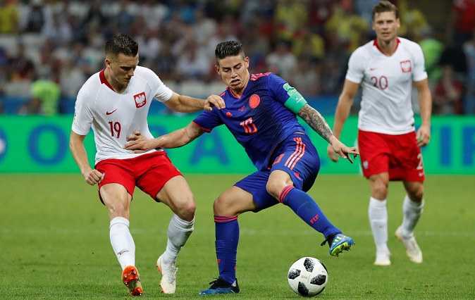 Soccer Football - World Cup - Group H - Poland vs Colombia - Kazan Arena, Kazan, Russia - June 24, 2018 Colombia's James Rodriguez in action with Poland's Piotr Zielinski