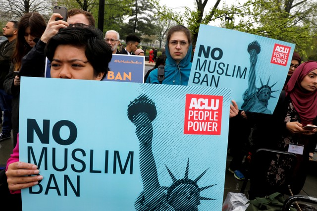 Protesters against Trump's Muslim ban gather outside the U.S. Supreme Court in Washington