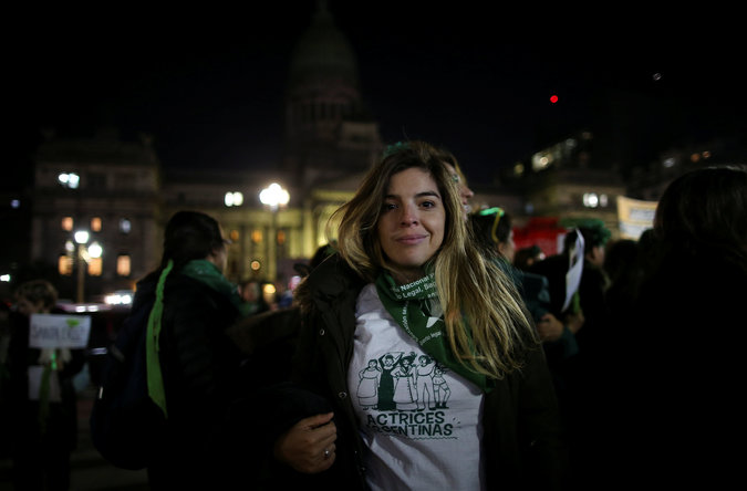 Dalma Maradona, daughter of former Argentine soccer star Diego Maradona, attends the protest among many more