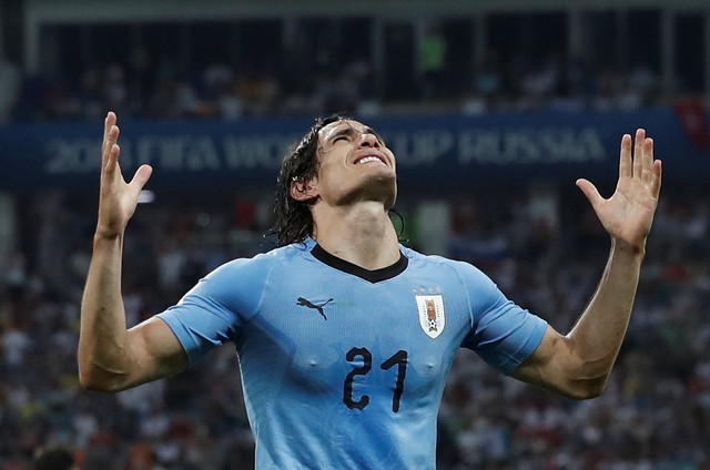 Uruguay's Edinson Cavani celebrates scoring their second goal.