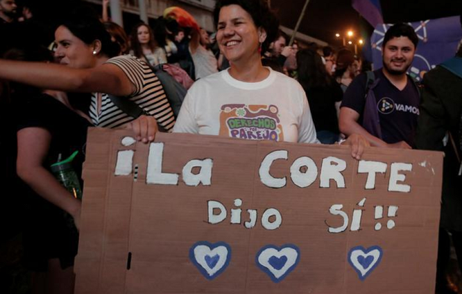 People celebrate after the Inter-American Court of Human Rights called on Costa Rica and Latin America to recognize equal marriage, in San Jose, Costa Rica, January 9, 2018. The sign reads: 