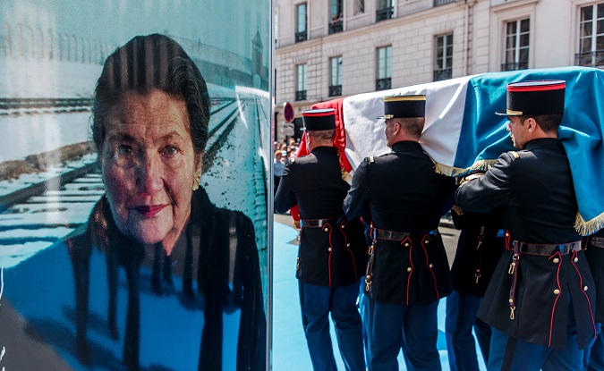 French Republican Guards carry the flag-draped coffin of Simone Veil during a national tribute before being laid to rest in the crypt of the Pantheon