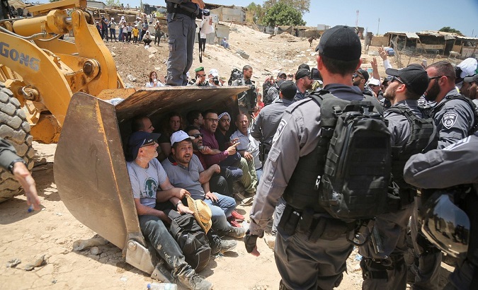 Palestinians resist attempts by Israeli occupation forces to demolish the village of Khan al-Ahmar.