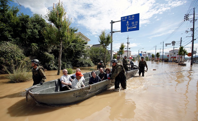 Japan Self-Defense Force soldiers rescue people from a flooded area in Mabi town in Kurashiki. July 8, 2018