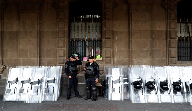 Police officers stand next to riot police shields during elections in Mexico City, Mexico July 1, 2018. Picture taken July 1, 2018