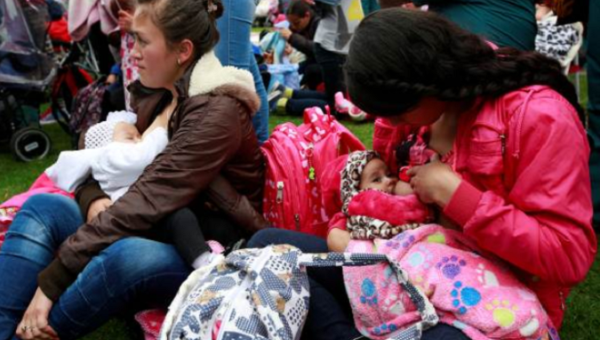 Mothers breastfeed their babies, as part of the celebration for World Breastfeeding Week, at Lovers Park in Bogota, Colombia. 