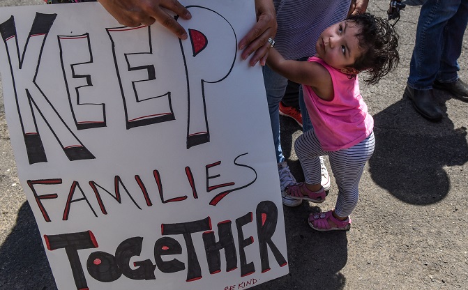 People participate in a protest against recent U.S. immigration policy of separating children from their families when they enter the United States as undocumented immigrants, in front of a Homeland Security facility in Elizabeth, New Jersey, U.S., June 17, 2018.