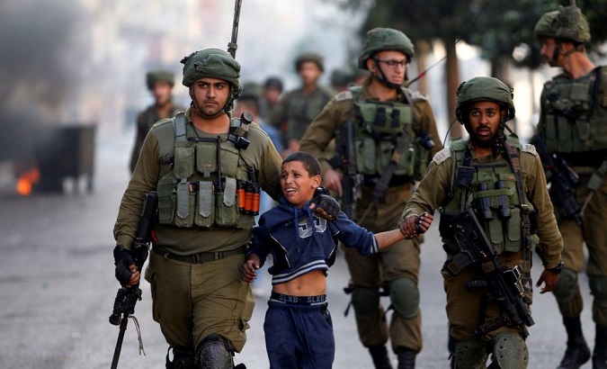 Israeli forces datain a Palestinian child in the occupied West Bank.