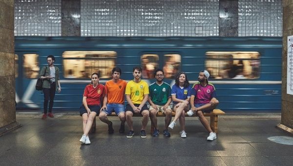 Gay rights activists, wearing soccer jerseys to form a rainbow flag, walk in Moscow's Red Square as they visit Russia during the World Cup, photo obtained by Reuters on July 10, 2018. 