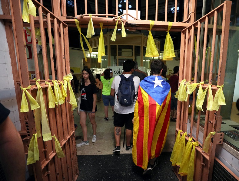 Activists wrapped in the Catalan flag walk the deserted halls of the oldest and best-known prison in Catalonia, which officially closed its doors in June 2017, just days before the 113th anniversary of its opening.
