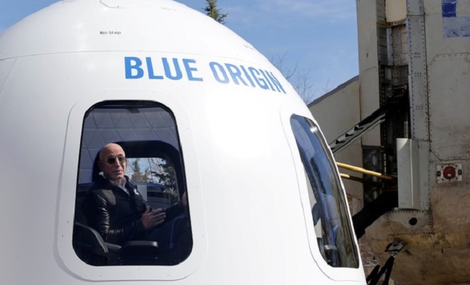 Amazon and Blue Origin founder Jeff Bezos addresses the media about the New Shepard rocket booster.