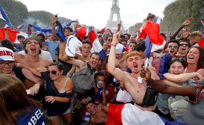 France fans celebrate in front of the Eiffel Tower after France win the 2018 World Cup.