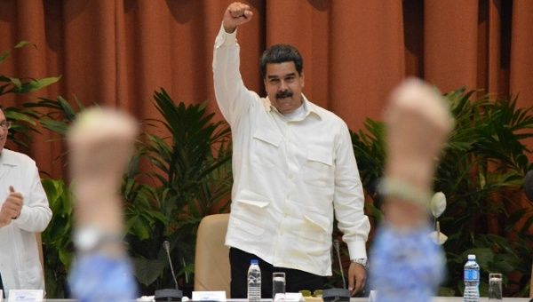 Maduro greets the crowd at the Sao Paulo Forum before his speech in Havana, Cuba. 
