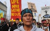 People march during a protest in Bismarck against plans to pass the Dakota Access pipeline under Lake Oahe and near the Standing Rock Indian Reservation, North Dakota