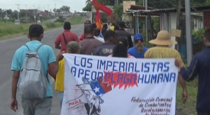 The Admirable Peasants March on its way to Caracas for almost two weeks, holding a sign against imperialism in Venezuela