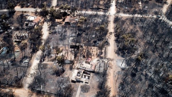 An aerial view shows burnt houses and trees following a wildfire in the village of Mati, near Athens, Greece, July 25, 2018. 