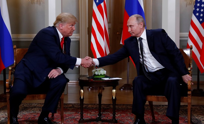 U.S. President Donald Trump and Russia's President Vladimir Putin shake hands as they meet in Helsinki, Finland July 16, 2018.