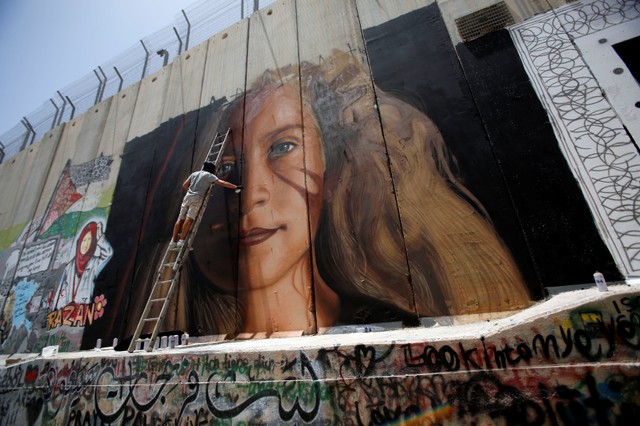 Ahed's family and Palestinian activists were preparing for her release with events and murals on the Israeli separation wall.
