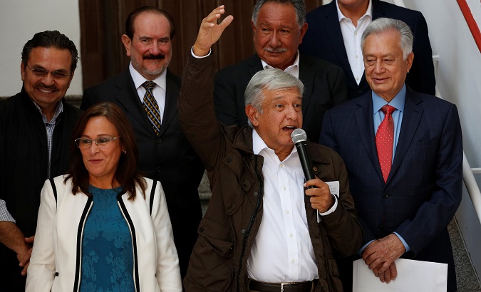 Mexico's future President Andres Manuel Lopez Obrador (C) addresses the media in Mexico City, July 27, 2018.