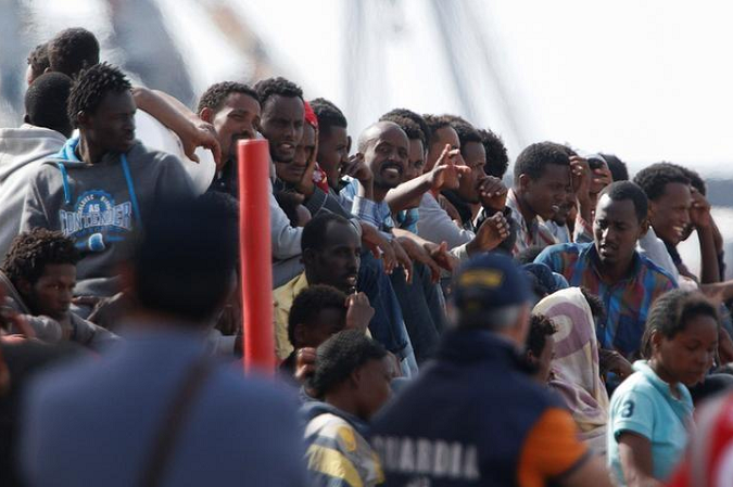 Migrants wait to disembark in the Sicilian harbour of Catania, Italy, May 28, 2016.