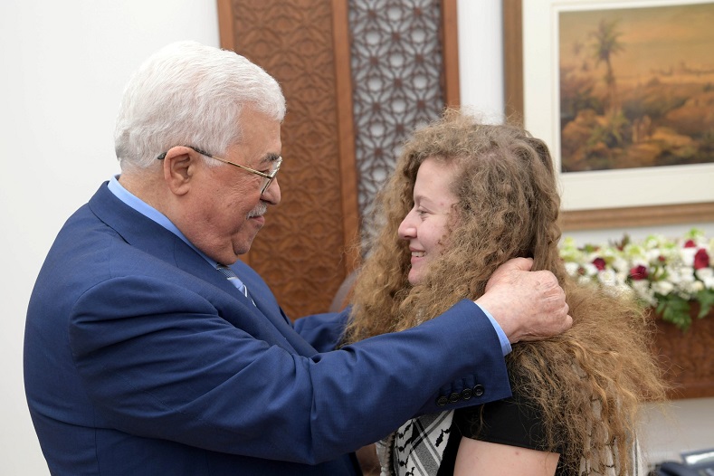 Palestinian President Mahmoud Abbas meets with freed Palestinian teenager Ahed Tamimi after she was released from an Israeli prison, in Ramallah in the occupied West Bank July 29, 2018. 