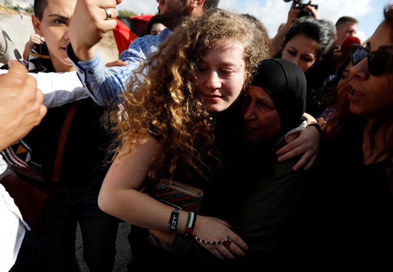 Palestinian teenager Ahed Tamimi is welcomed by relatives and supporters after she was released from an Israeli prison, at Nabi Saleh village in the occupied West Bank July 29, 2018.